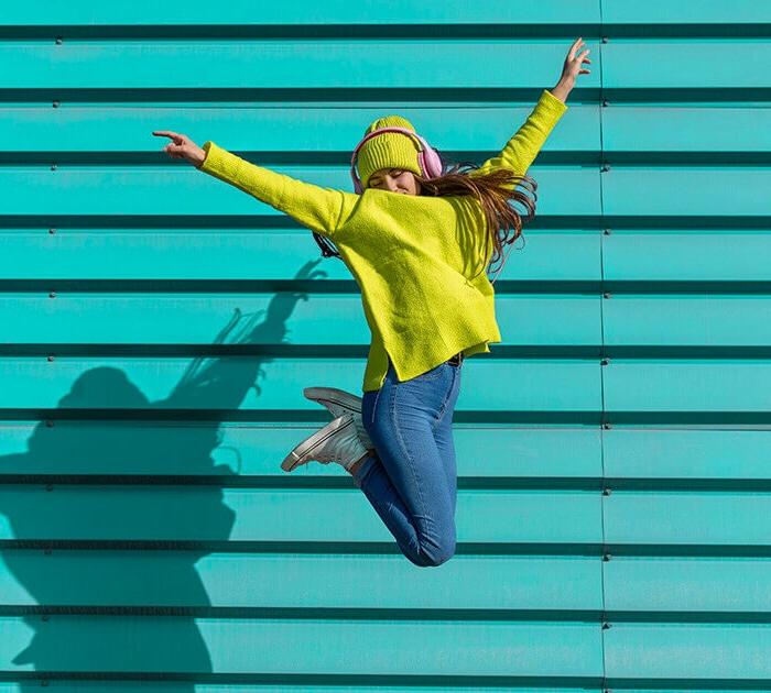 A young girl jumping in the air